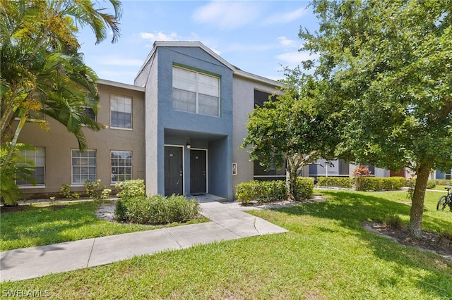201 Santa Clara Dr Unit 13, Naples, FL 34104 - multi unit property with a front lawn and stucco siding