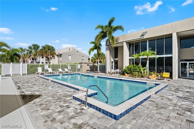 view of pool featuring a patio