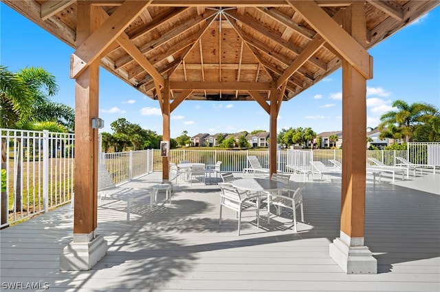 201 Santa Clara Dr Unit 13, Naples, FL 34104 - exterior space with fence, a gazebo, outdoor dining area, and a water view