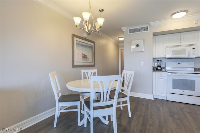 dining space with ornamental molding, dark hardwood / wood-style floors, and a chandelier