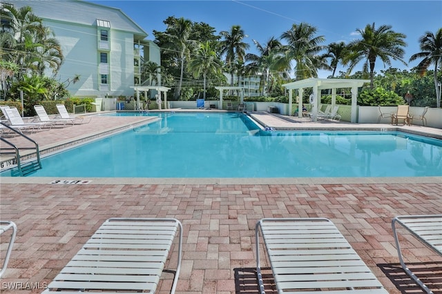 view of swimming pool featuring a patio area