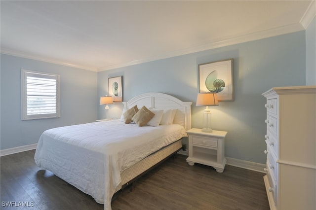 bedroom featuring ornamental molding and dark hardwood / wood-style flooring