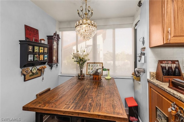 dining room with a notable chandelier