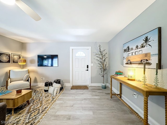 entrance foyer with ceiling fan and light wood-type flooring