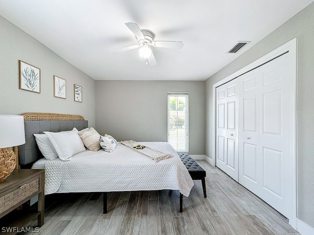 bedroom featuring a closet, ceiling fan, and hardwood / wood-style floors