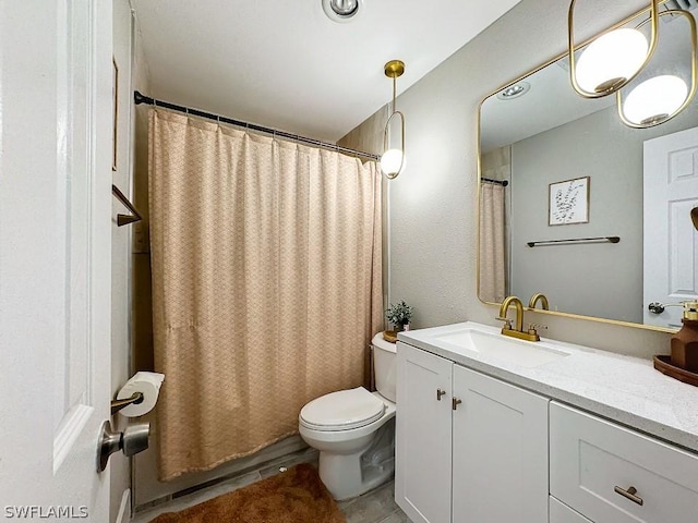 full bath with toilet, vanity, and tile patterned floors