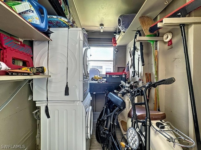 garage with stacked washer / dryer