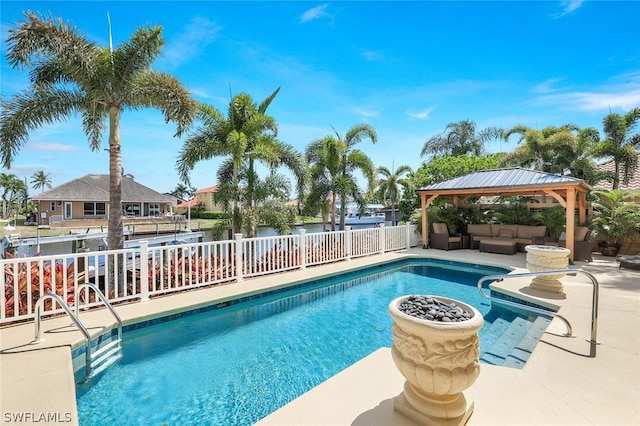 view of swimming pool with a gazebo, outdoor lounge area, and a patio