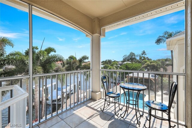 balcony featuring a water view