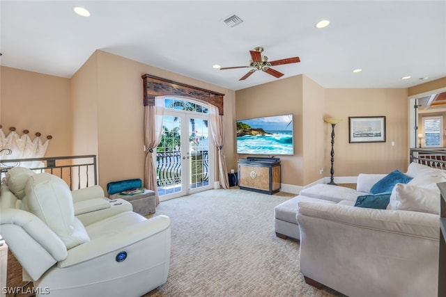 carpeted living room featuring ceiling fan and french doors