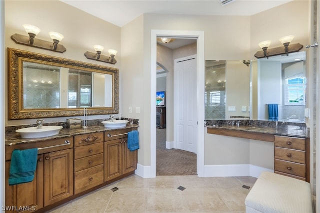 bathroom with tile patterned flooring and vanity