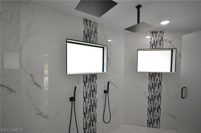 bathroom with a tile shower