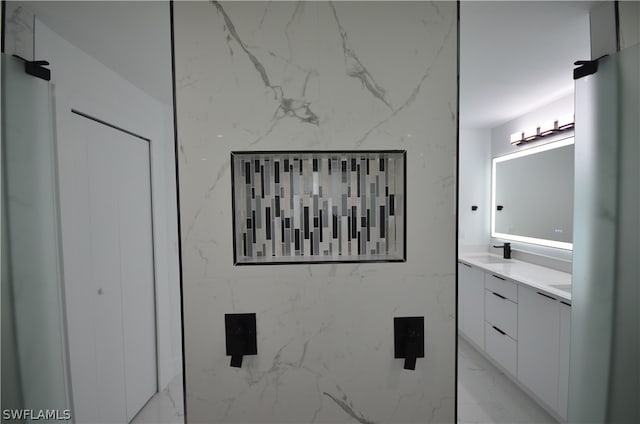 bathroom featuring tile floors and vanity