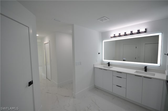 bathroom featuring double vanity and tile flooring