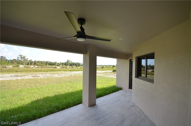 view of patio / terrace featuring ceiling fan