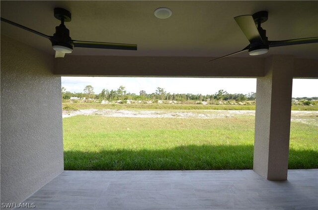 view of yard featuring a patio and ceiling fan