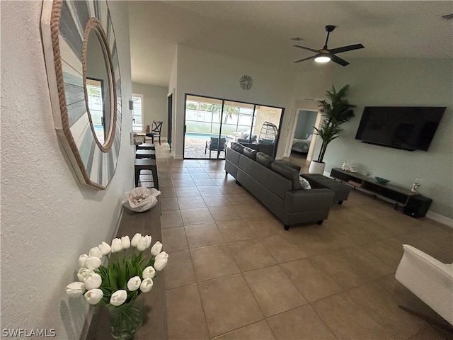 tiled living room with ceiling fan