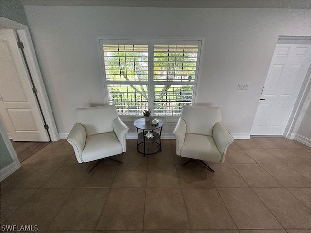 living area featuring tile patterned floors