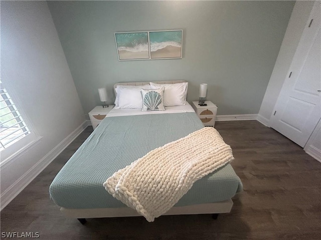 bedroom featuring dark wood-type flooring