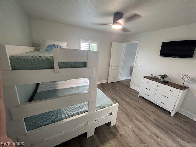 bedroom featuring hardwood / wood-style flooring and ceiling fan