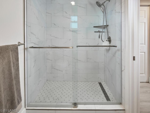 bathroom with a shower with shower door