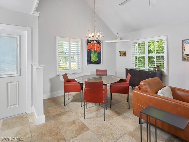 dining room with a chandelier and high vaulted ceiling