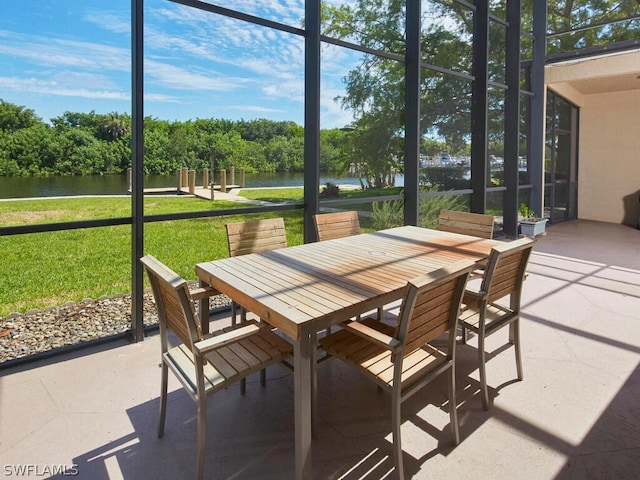 sunroom with a water view