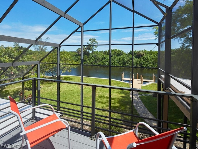 sunroom / solarium with a water view