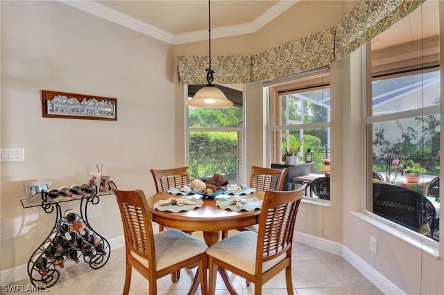 tiled dining room featuring ornamental molding