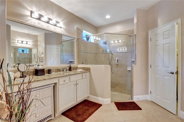 bathroom featuring vanity, tile patterned floors, and an enclosed shower