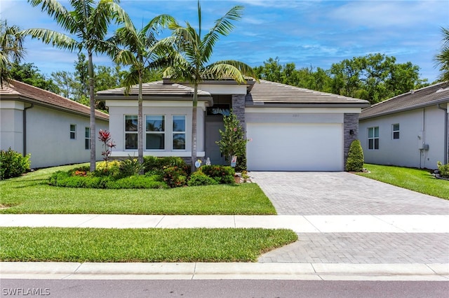 single story home with a front lawn and a garage