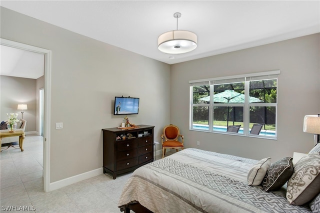 bedroom with light tile patterned floors