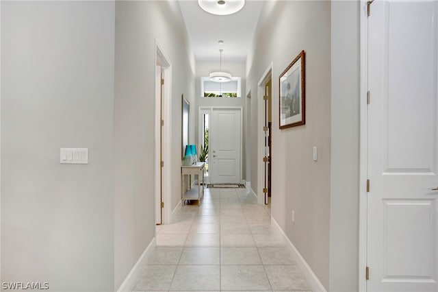 hallway with light tile patterned floors