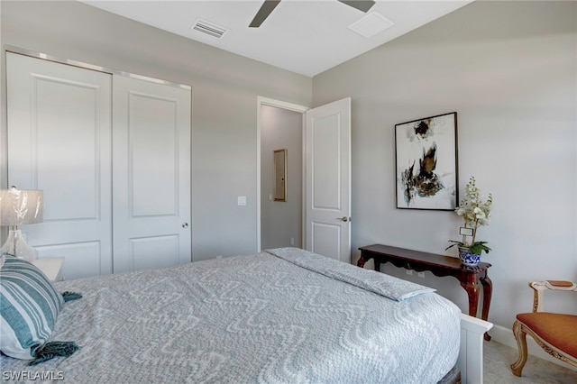 carpeted bedroom with a closet and ceiling fan