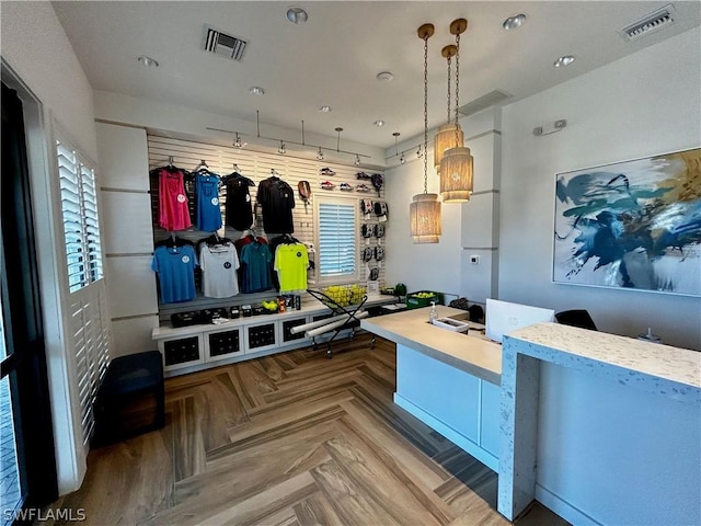 mudroom with plenty of natural light and parquet floors