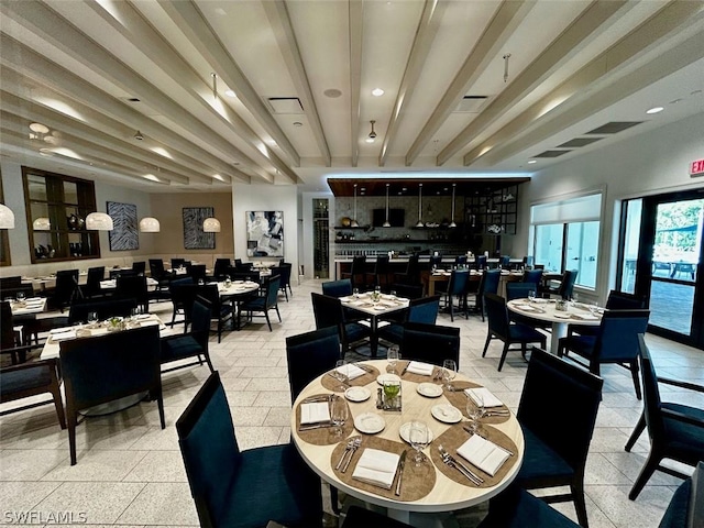 dining room with beam ceiling