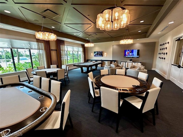 carpeted dining room featuring an inviting chandelier