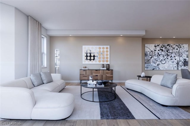 living room featuring recessed lighting, baseboards, and wood finished floors