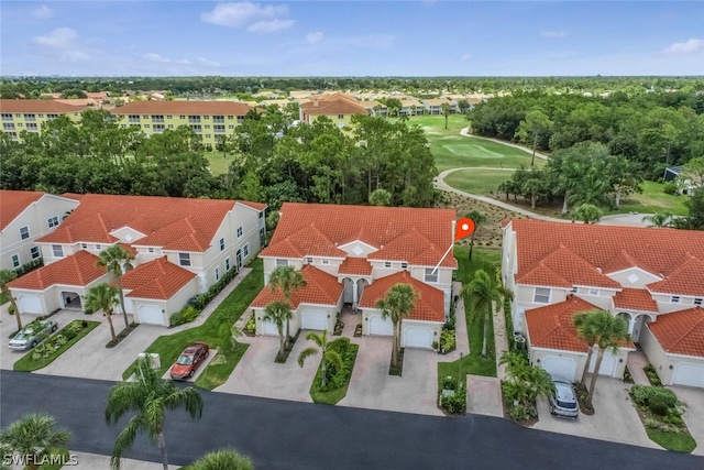 bird's eye view with golf course view and a residential view
