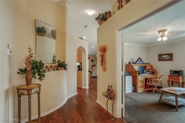 hall featuring ornamental molding and carpet floors