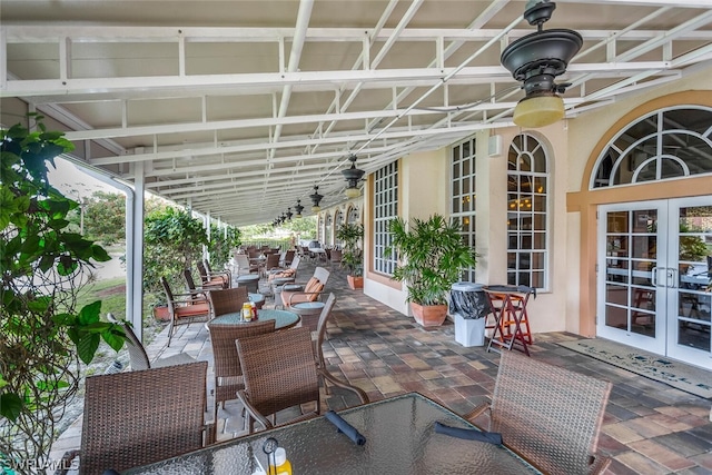 view of patio / terrace featuring ceiling fan and french doors