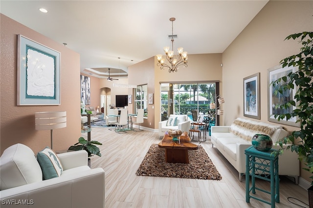 living room with a notable chandelier and light wood-type flooring