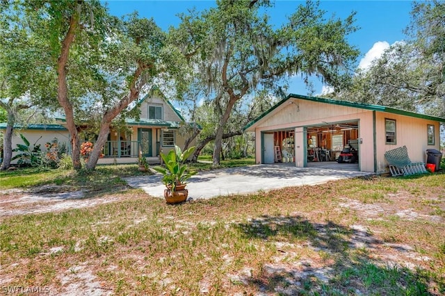 view of front facade featuring a porch and a garage