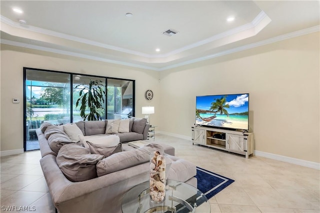 living room with a raised ceiling, crown molding, and light tile patterned floors