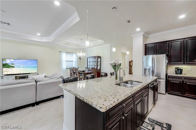 kitchen with sink, a raised ceiling, and crown molding