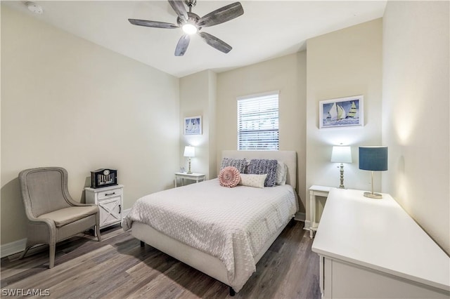 bedroom with dark hardwood / wood-style floors and ceiling fan