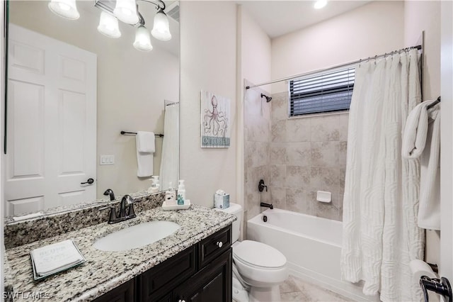 full bathroom featuring vanity, toilet, shower / bath combo, and an inviting chandelier