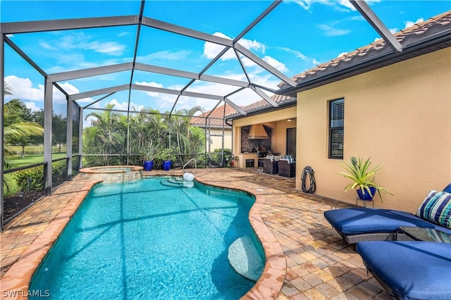 view of pool featuring an in ground hot tub, a lanai, and a patio area