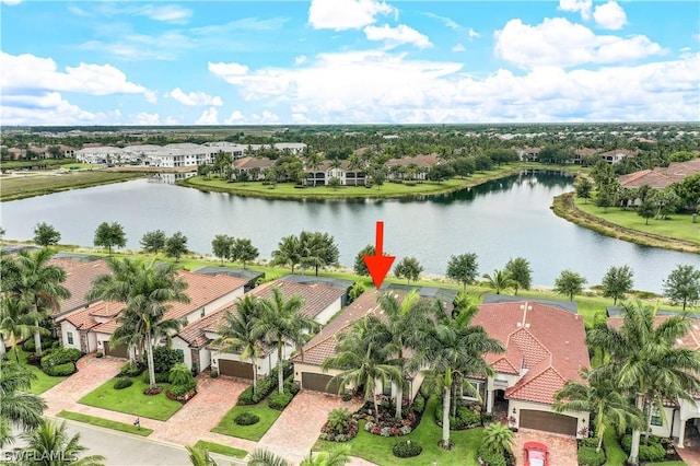 birds eye view of property featuring a water view