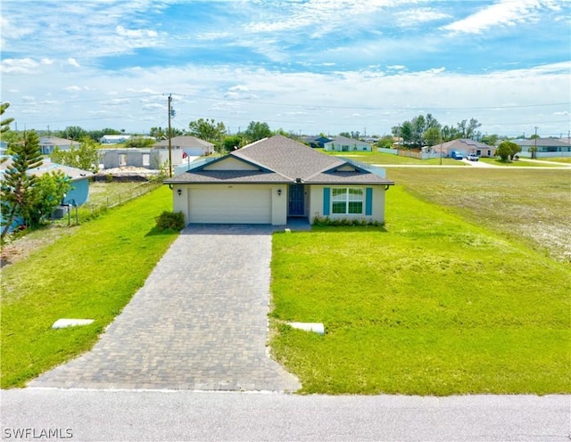 ranch-style house featuring a garage and a front lawn